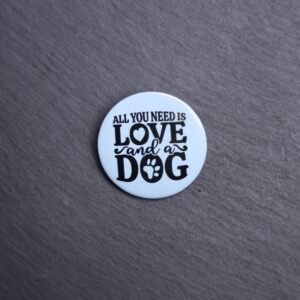All You Need Is Love And A Dog Button. These buttons are made with photo paper, metal round, and metal backing. These buttons are vibrant and fun to use on bags or vests.