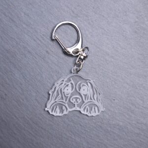 American Cocker Spaniel Bag Tag. This bag tag is made with engraved acrylic. Comes with lobster clasp topper that easily hooks to a bag, zippers, keychains,
