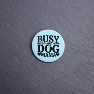 Busy Being A Dog Mama Button. These buttons are made with photo paper, metal round, and metal backing. These buttons are vibrant and fun to use on bags or vests.