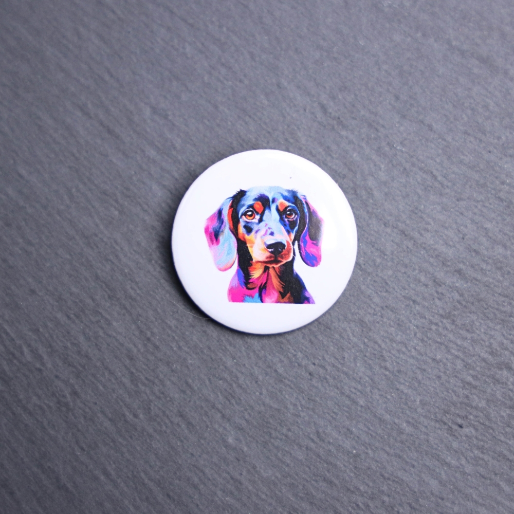 Dachshund Watercolor Button. These buttons are made with photo paper, metal round, and metal backing. These buttons are vibrant and fun to use on bags or vests.