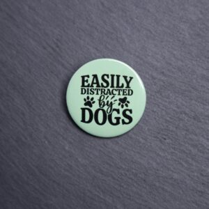 Easily Distracted By Dogs Button. These buttons are made with photo paper, metal round, and metal backing. These buttons are vibrant and fun to use on bags or vests.