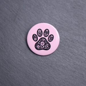 Floral Paw Pink Button. These buttons are made with photo paper, metal round, and metal backing. These buttons are vibrant and fun to use on bags or vests.