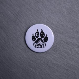 Forest Paw Gray Button. These buttons are made with photo paper, metal round, and metal backing. These buttons are vibrant and fun to use on bags or vests.