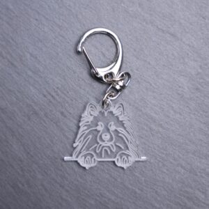 Keeshond Bag Tag. This bag tag is made with engraved acrylic. Comes with lobster clasp topper that easily hooks to a bag, zippers, keychains,