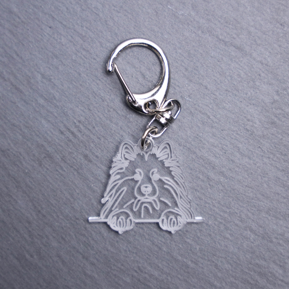 Keeshond Bag Tag. This bag tag is made with engraved acrylic. Comes with lobster clasp topper that easily hooks to a bag, zippers, keychains,