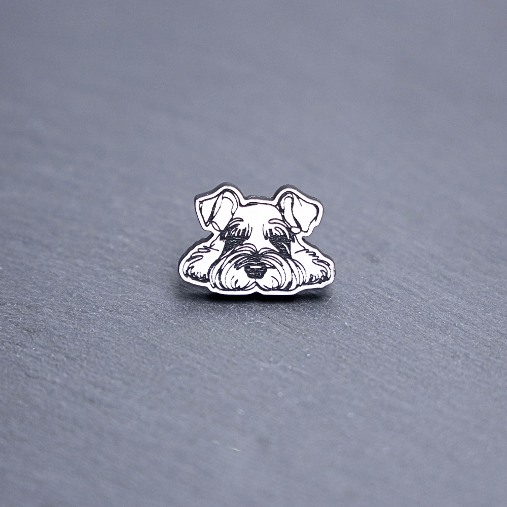 Mini Schnauzer Engraved Acrylic Pin. These acrylic pins are made with engraved cast acrylic. These pins are white and black with a black pin back.
