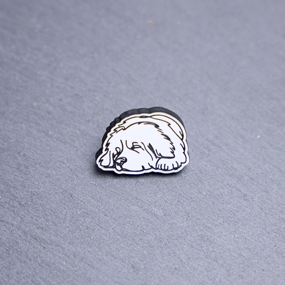 Newfoundland Engraved Acrylic Pin. These acrylic pins are made with engraved cast acrylic. These pins are white and black with a black pin back.