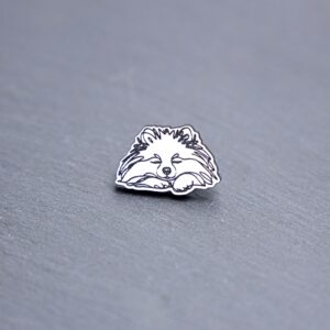 Pomeranian Engraved Acrylic Pin. These acrylic pins are made with engraved cast acrylic. These pins are white and black with a black pin back.