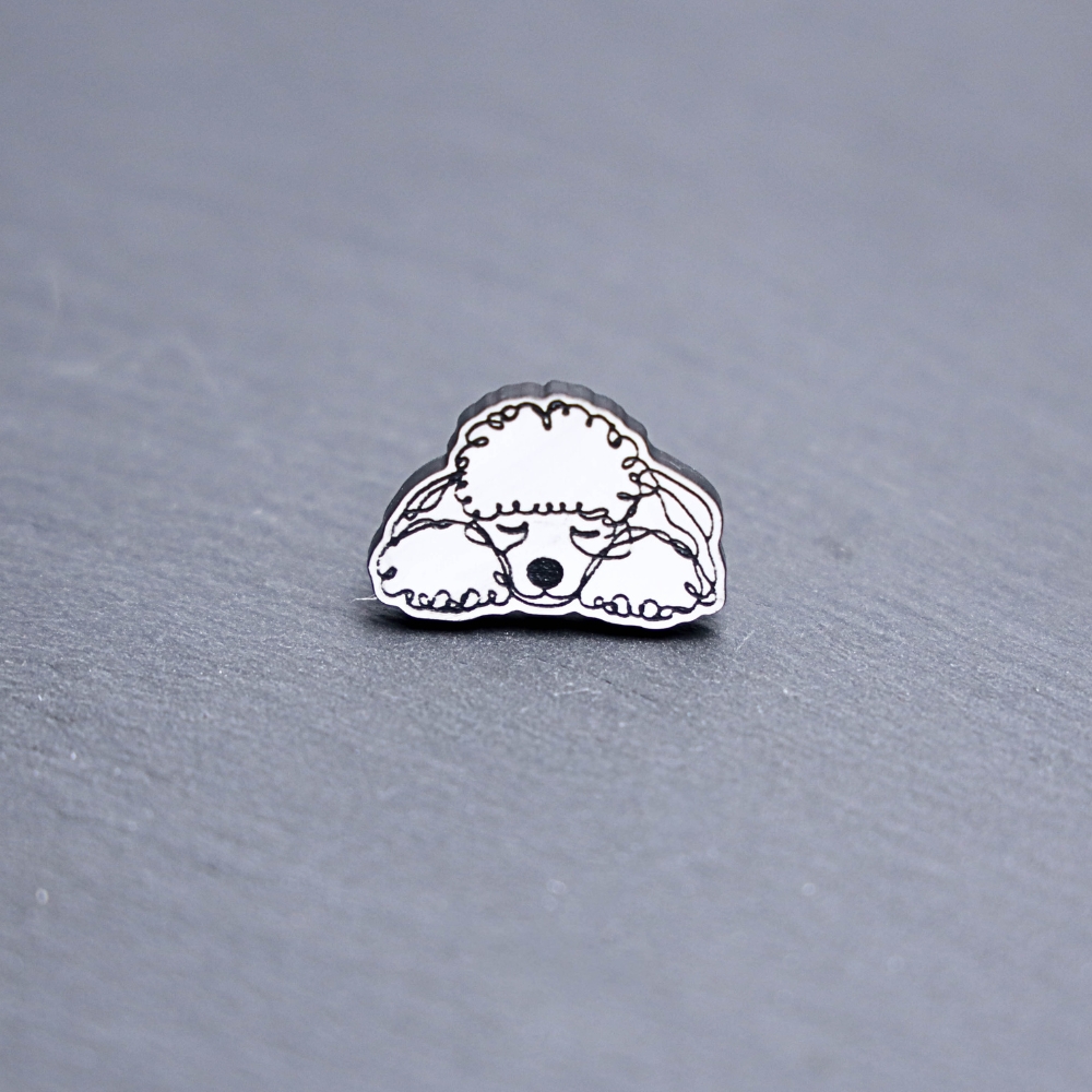 Poodle Engraved Acrylic Pin. These acrylic pins are made with engraved cast acrylic. These pins are white and black with a black pin back.