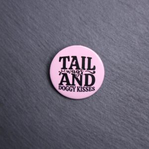 Tail Wags And Dog Kisses Button. These buttons are made with photo paper, metal round, and metal backing. These buttons are vibrant and fun to use on bags or vests.