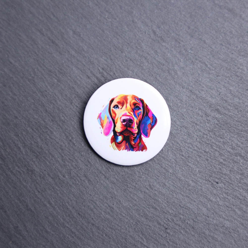 Vizsla Watercolor Button. These buttons are made with photo paper, metal round, and metal backing. These buttons are vibrant and fun to use on bags or vests.