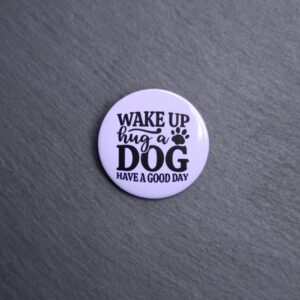 Wake Up Hug A Dog Have A Good Day Button. These buttons are made with photo paper, metal round, and metal backing. These buttons are vibrant and fun to use on bags or vests.