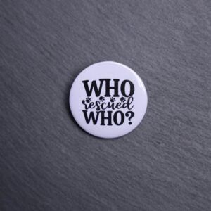 Who Rescued Who Button. These buttons are made with photo paper, metal round, and metal backing. These buttons are vibrant and fun to use on bags or vests.