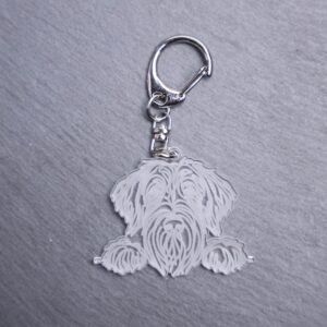 Wirehaired Pointing Griffon Bag Tag. This bag tag is made with engraved acrylic. Comes with lobster clasp topper that easily hooks to a bag, zippers, keychains, and lanyards for fun display and swivels. Clear opposite backside. FEATURES: Approximately 1.3″ In Height Silver Lobster Clasp Swivels Acrylic Check out our Instagram for more pictures and videos of this product. Colors may vary due to screen resolution. Not intended for children or dogs.