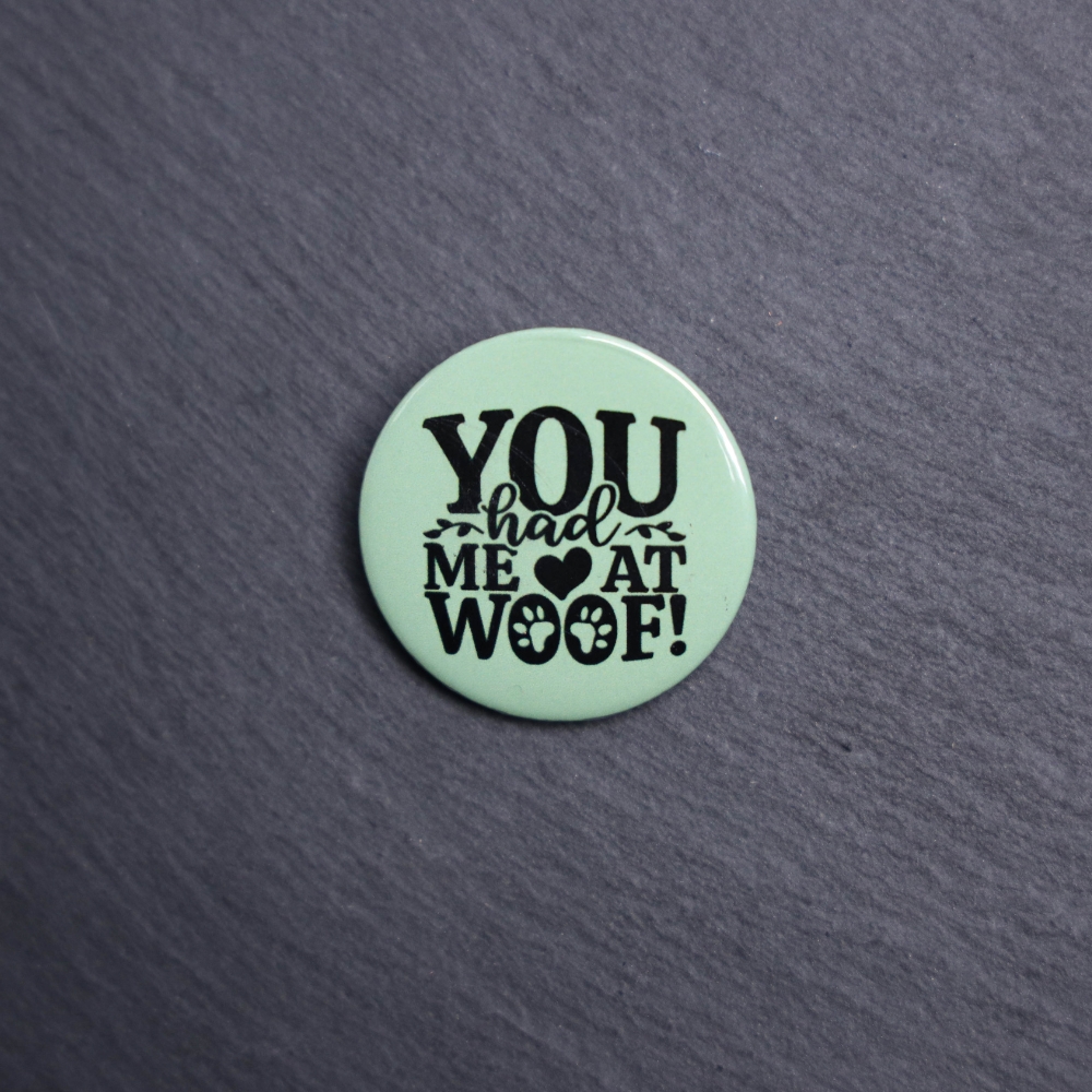 You Had Me At Woof Button. These buttons are made with photo paper, metal round, and metal backing. These buttons are vibrant and fun to use on bags or vests.