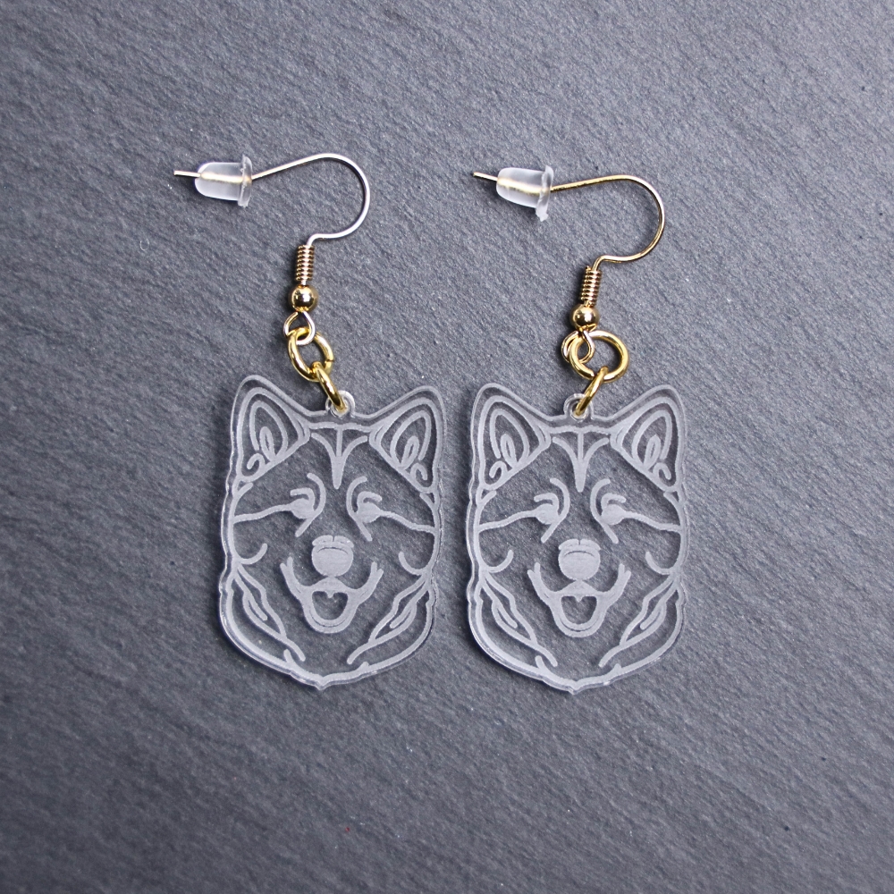 Akita Earrings. These earrings are made with engraved acrylic. Comes with gold hooks that is nickel free. Adorable dangle earrings for dog lovers.