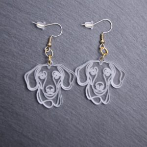 Dachshund Earrings. These earrings are made with engraved acrylic. Comes with gold hooks that is nickel free. Adorable dangle earrings for dog lovers.