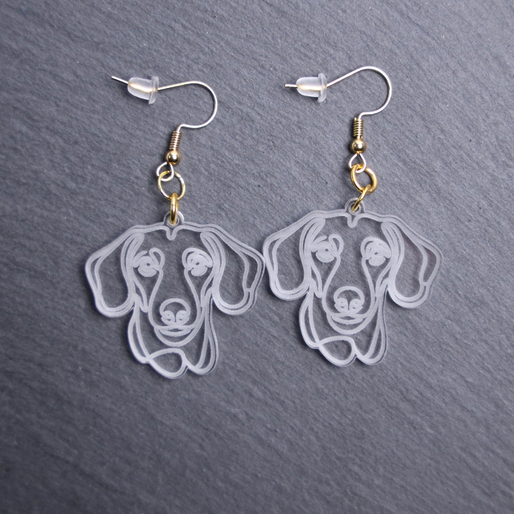Dachshund Earrings. These earrings are made with engraved acrylic. Comes with gold hooks that is nickel free. Adorable dangle earrings for dog lovers.