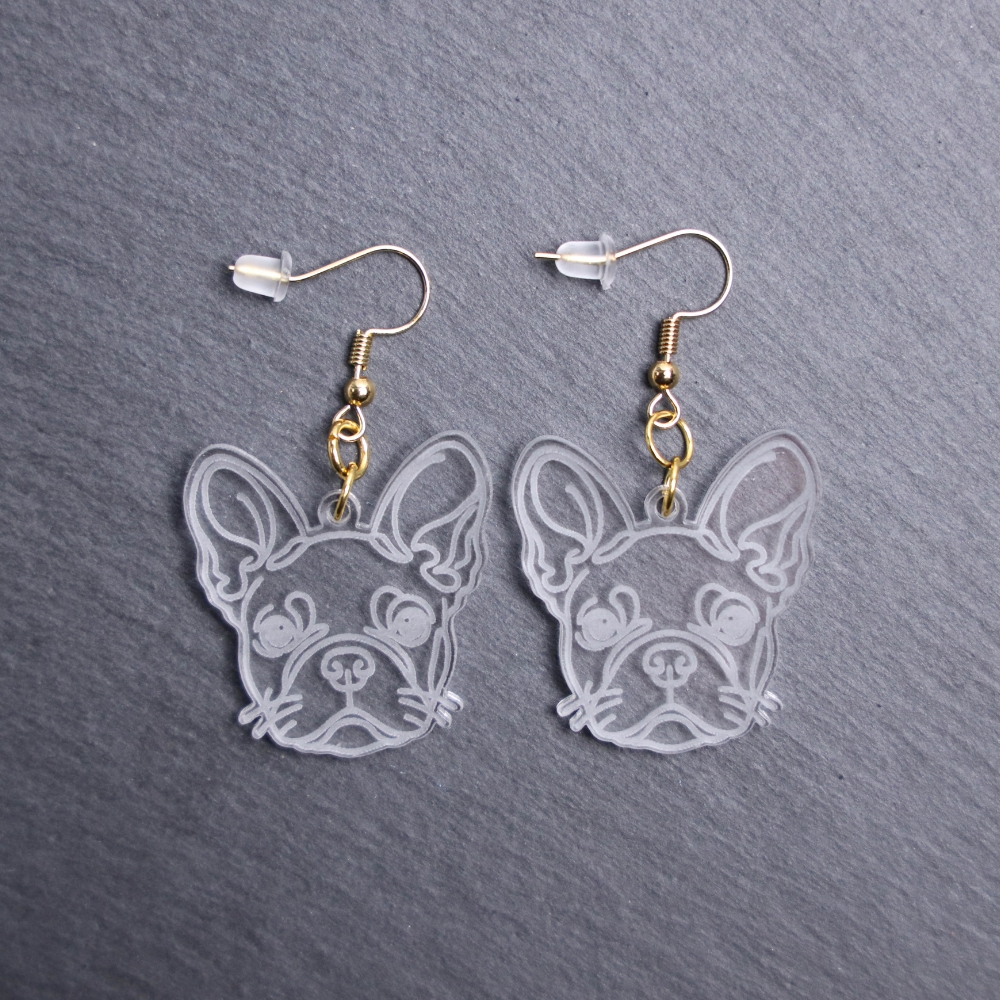 French Bulldog Earrings. These earrings are made with engraved acrylic. Comes with gold hooks that is nickel free. Adorable dangle earrings for dog lovers.