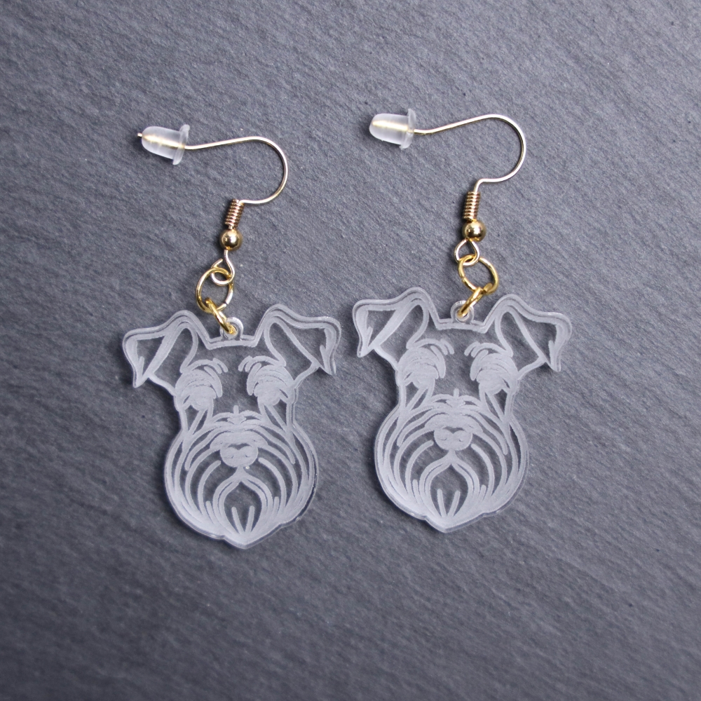 Giant Schnauzer Earrings. These earrings are made with engraved acrylic. Comes with gold hooks that is nickel free. Adorable dangle earrings for dog lovers.