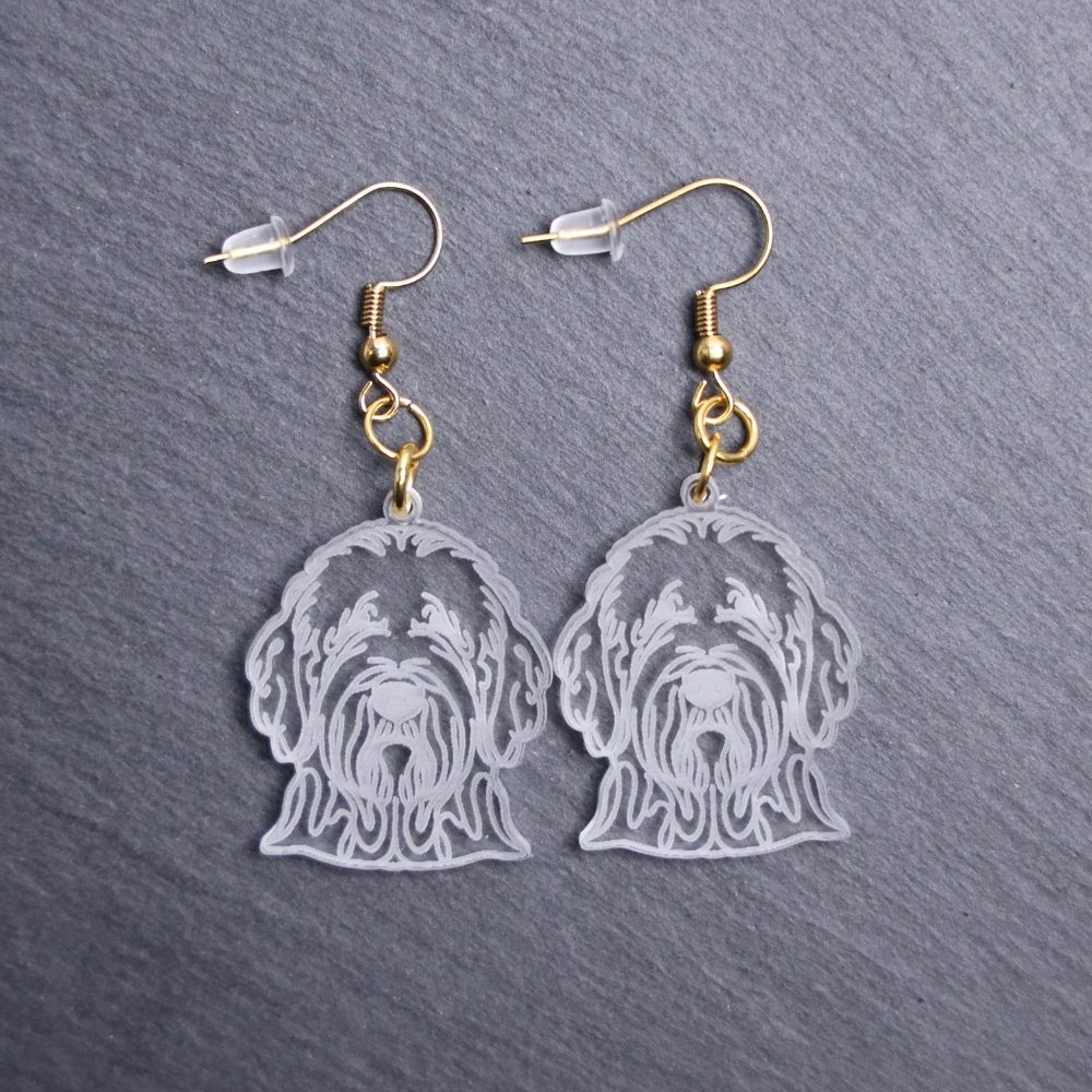 Komondor Earrings. These earrings are made with engraved acrylic. Comes with gold hooks that is nickel free. Adorable dangle earrings for dog lovers.