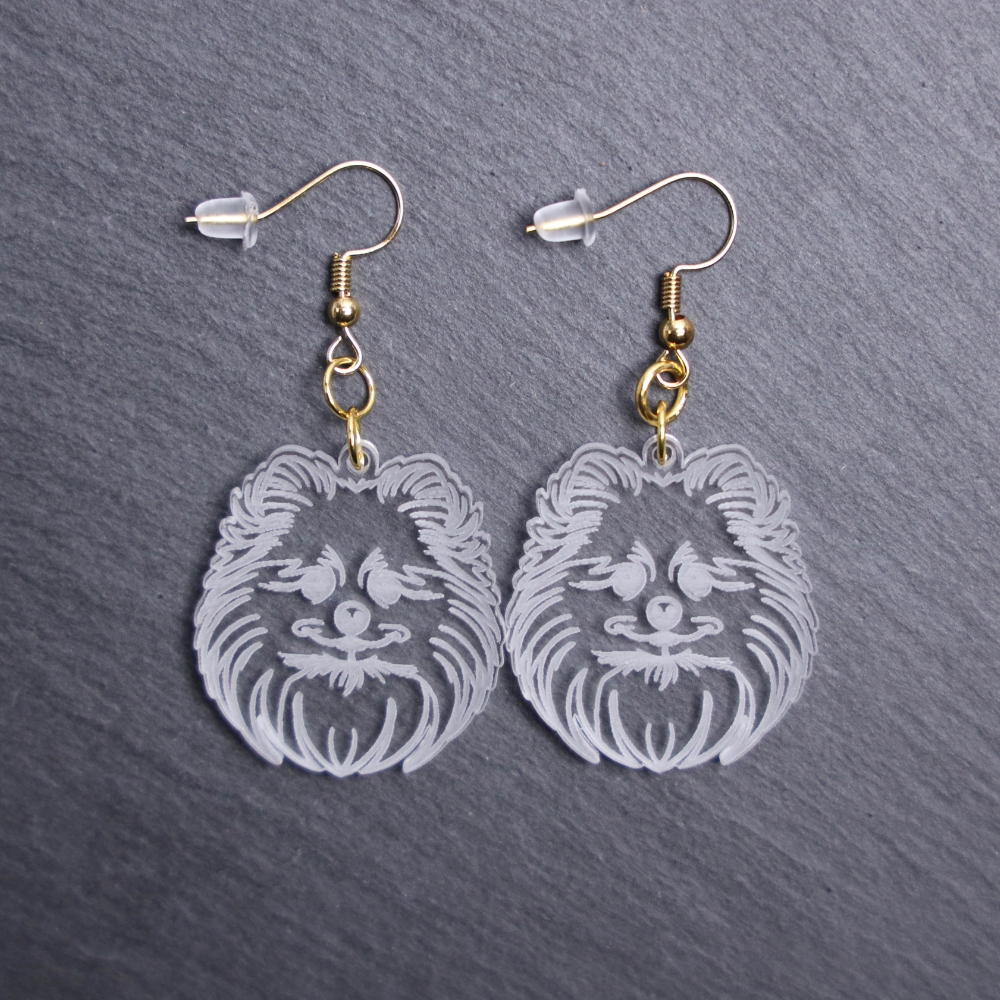 Pomeranian Earrings. These earrings are made with engraved acrylic. Comes with gold hooks that is nickel free. Adorable dangle earrings for dog lovers.