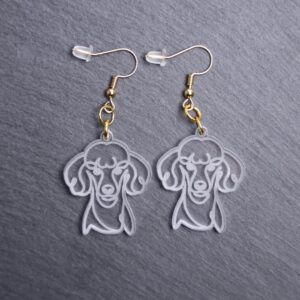 Poodle Earrings. These earrings are made with engraved acrylic. Comes with gold hooks that is nickel free. Adorable dangle earrings for dog lovers.