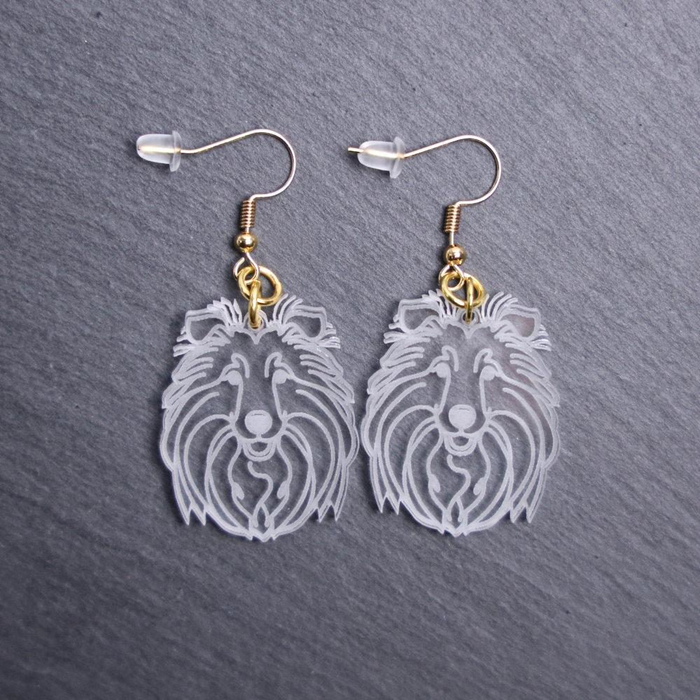Shetland Sheepdog Earrings. These earrings are made with engraved acrylic. Comes with gold hooks that is nickel free. Adorable dangle earrings for dog lovers.