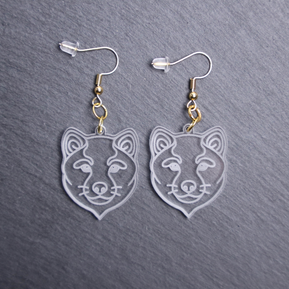 Shiba Inu Earrings. These earrings are made with engraved acrylic. Comes with gold hooks that is nickel free. Adorable dangle earrings for dog lovers.